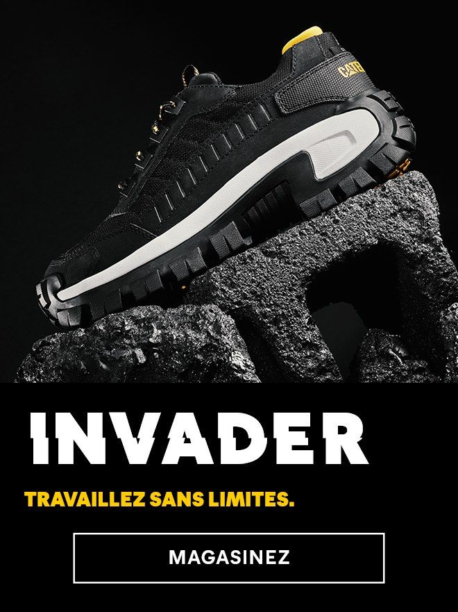 Une chaussure Invader noire et blanche sur un rocher.