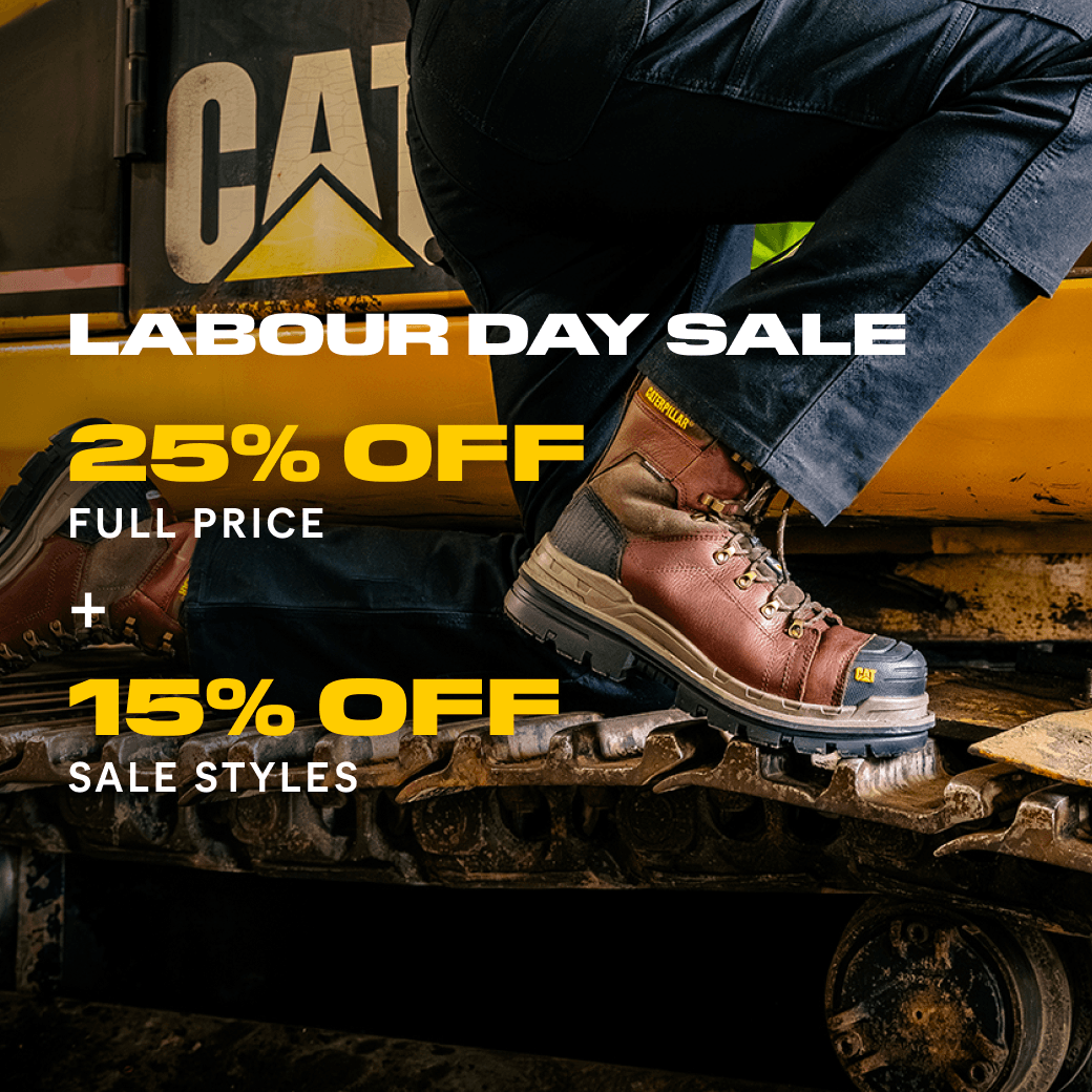 Boots standing on caterpillar tracks.