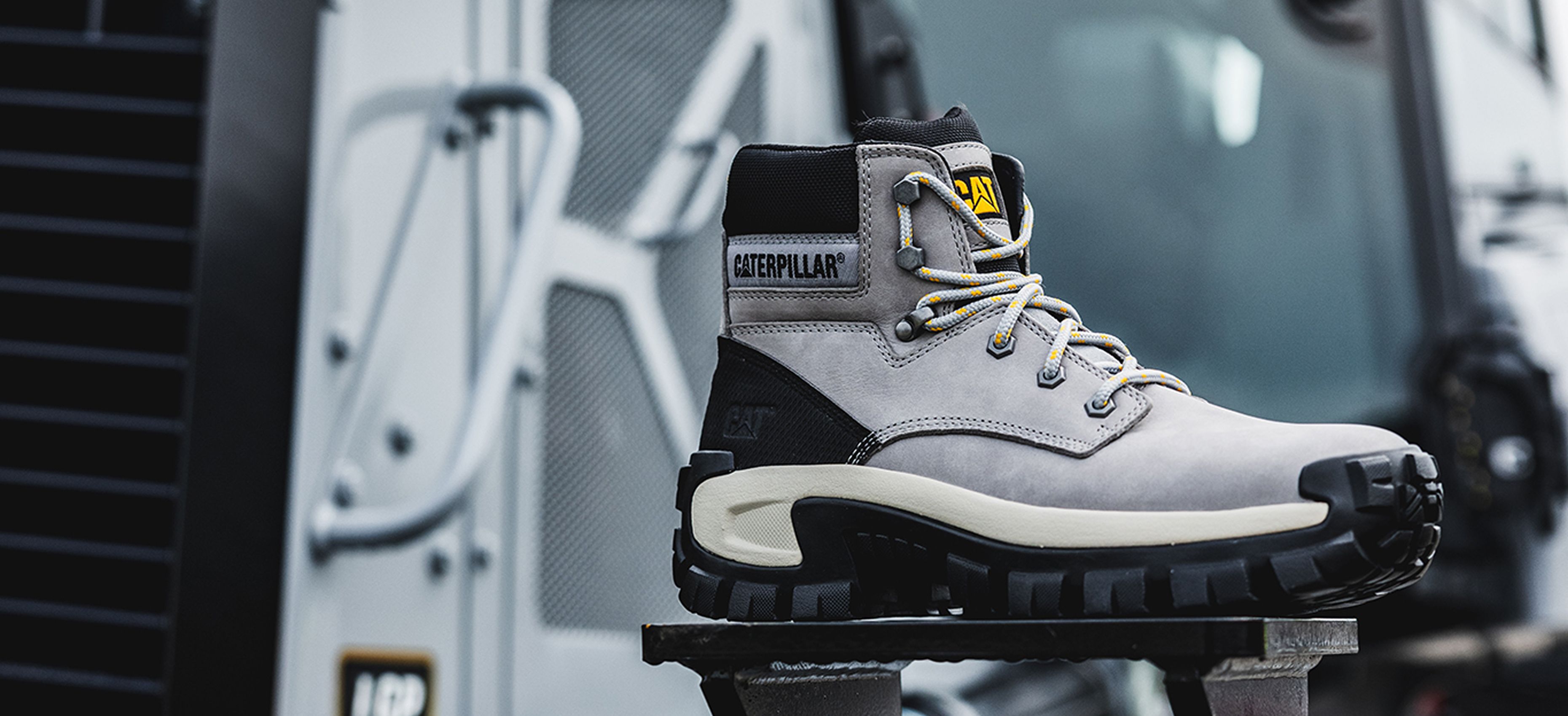 Grey boot on Cat equipment.