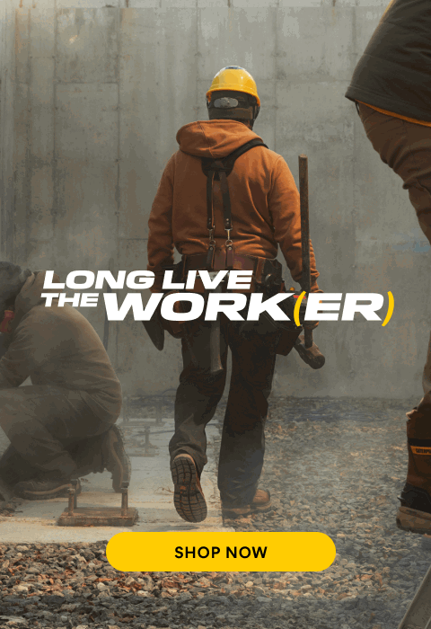 Man walking away with a sledgehammer in CAT boots.