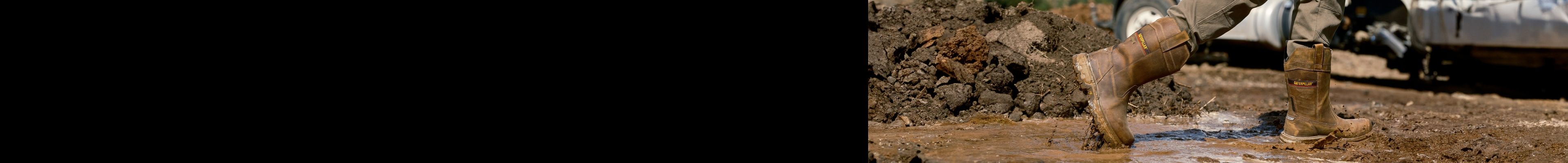 Boots walking through deep mud.