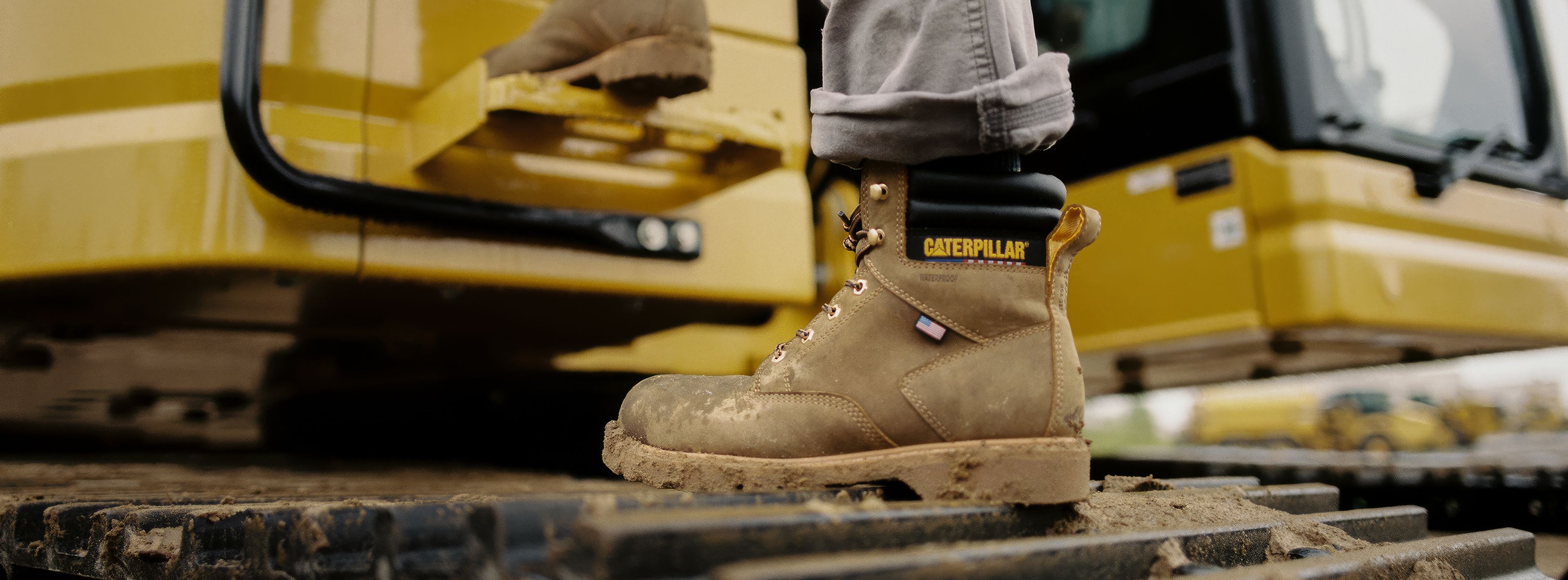 Boots getting into the cab of heavy machinery.