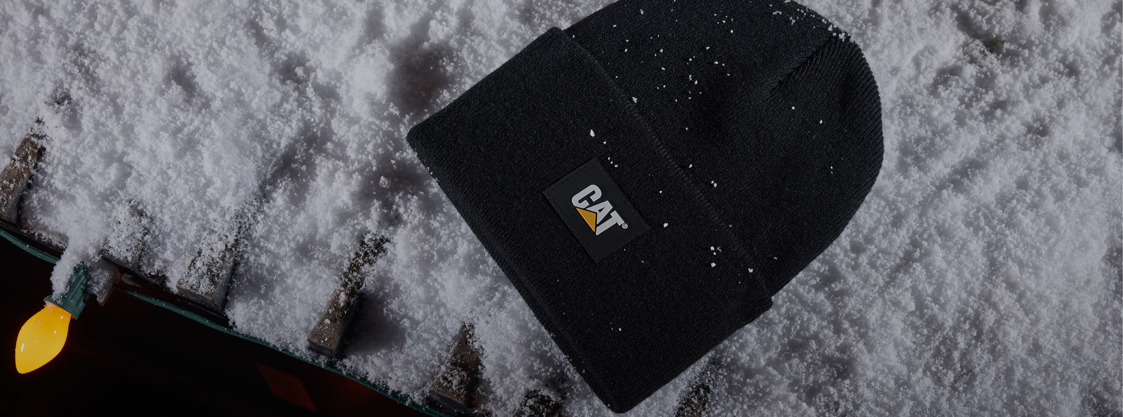 Standing beside tracked equipment.