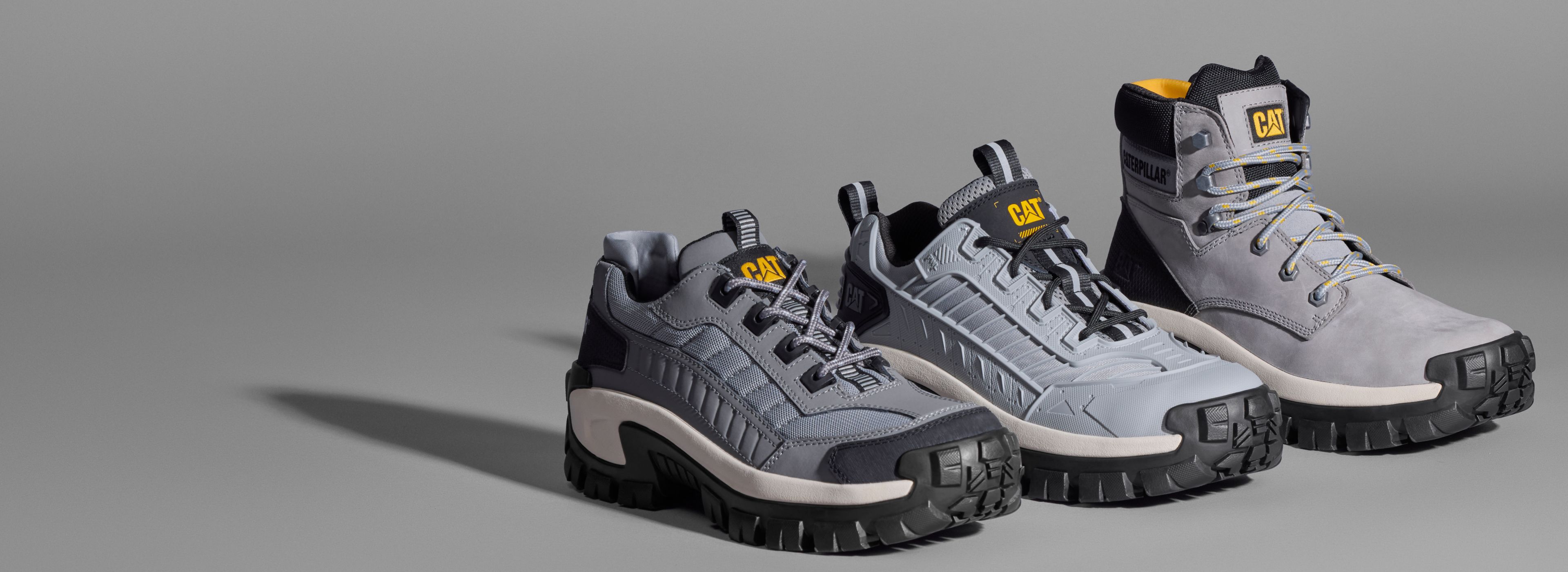 Three grey boots.