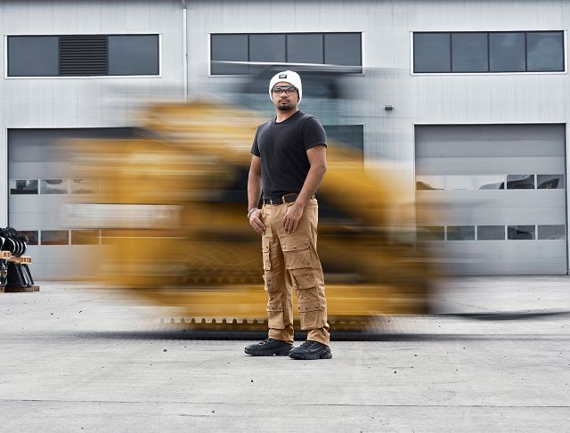 Standing in front of fast-moving CAT machinery.