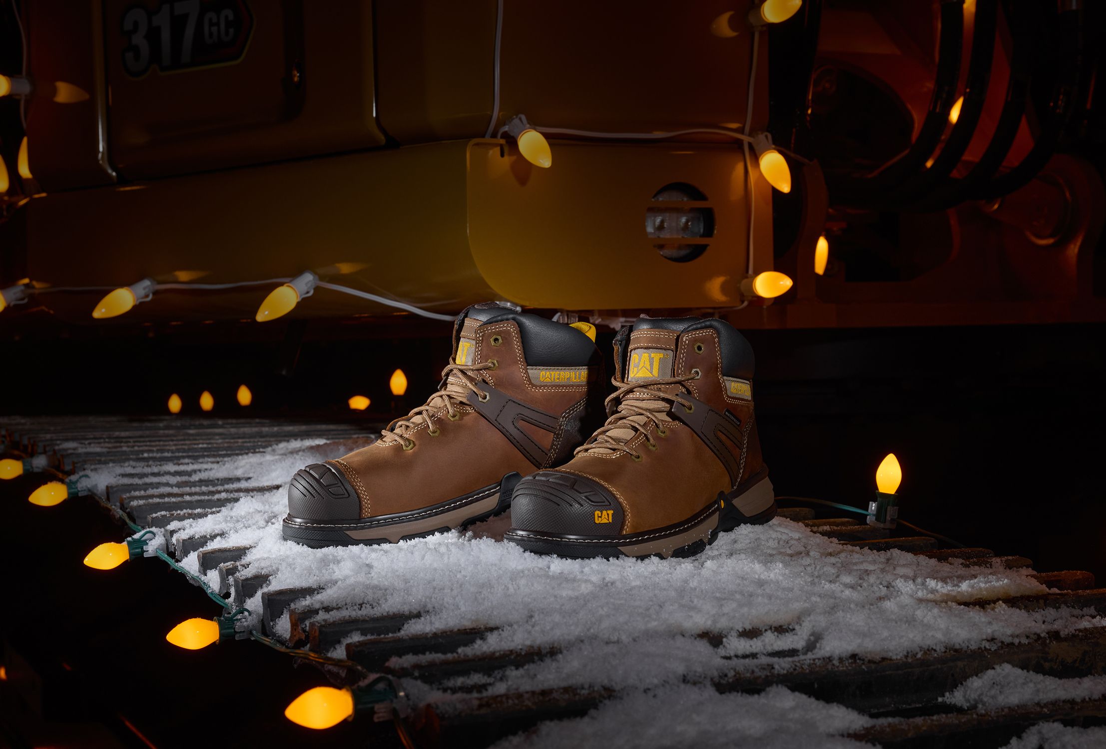 Boots on snowy caterpillar tracks.