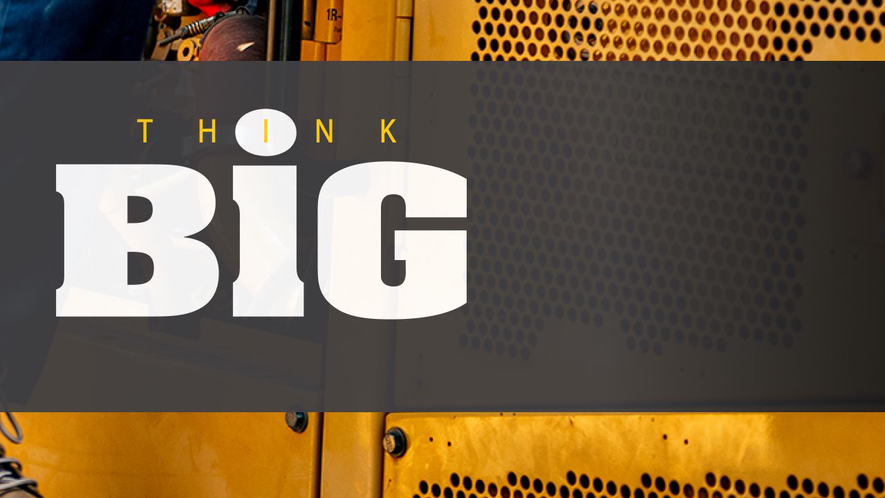 Opening the engine compartment of a Cat bulldozer.