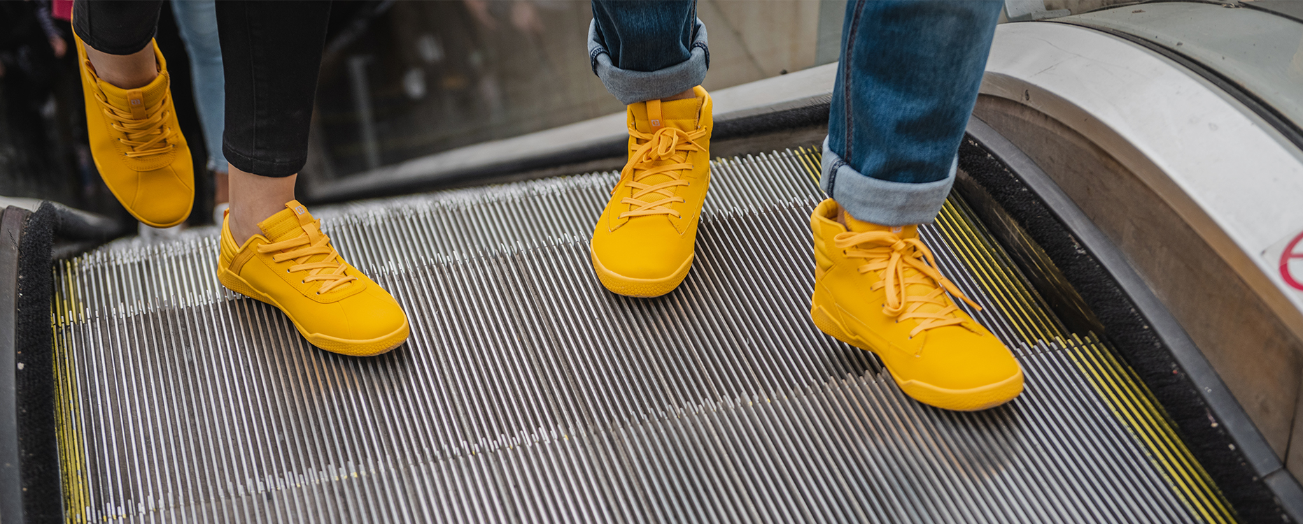 Cat Code Shoes on an escalator