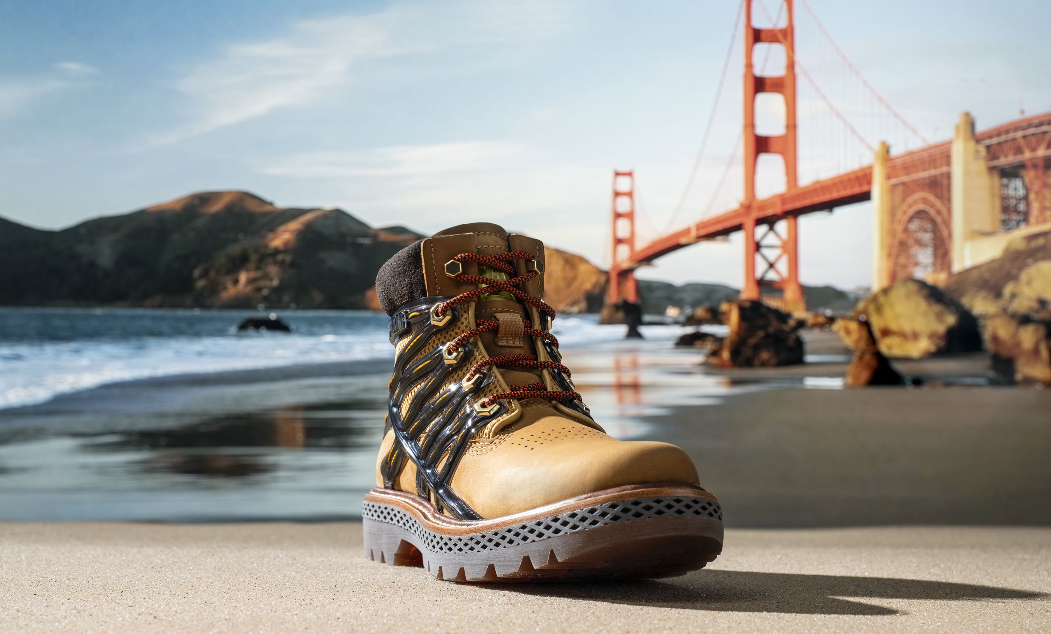 Brown boot on a beach with the Golden Gate Bridge in the background.