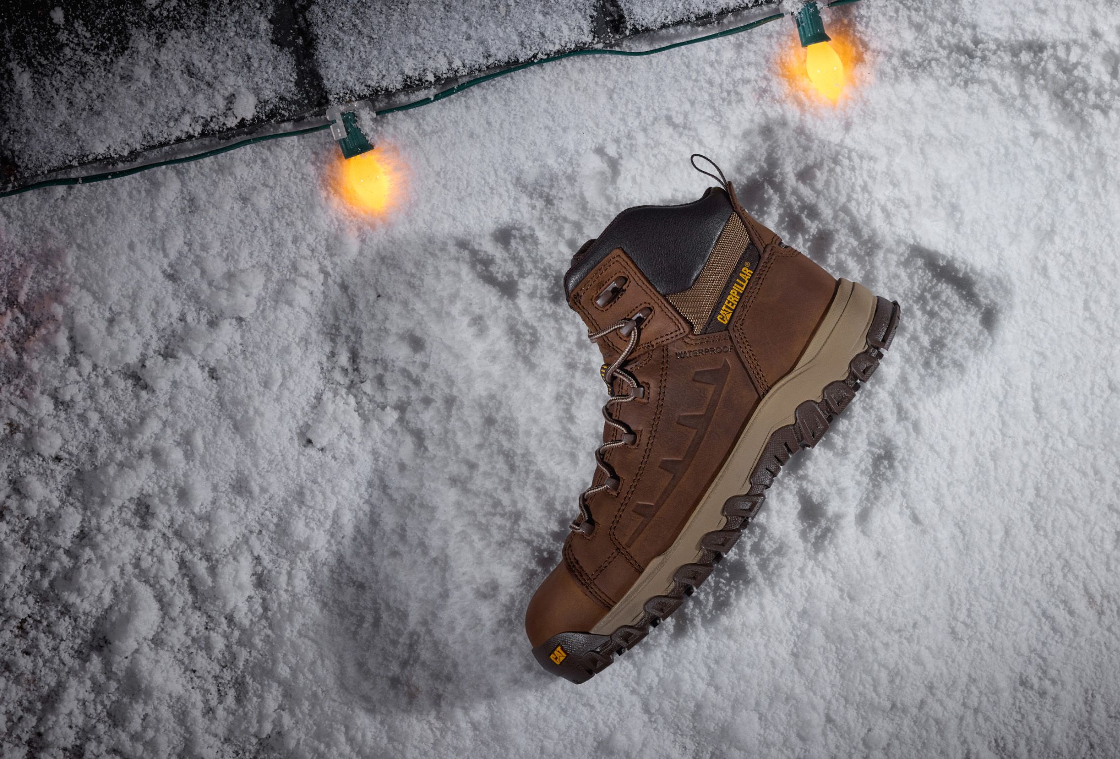 Boots on snowy caterpillar tracks.