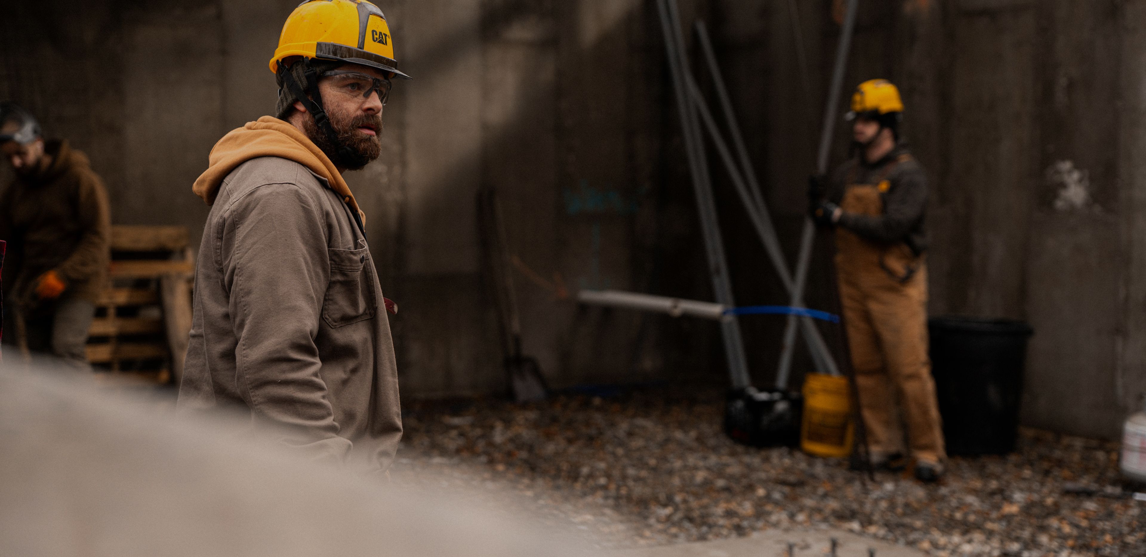 Workers in a semi-constructed basement.