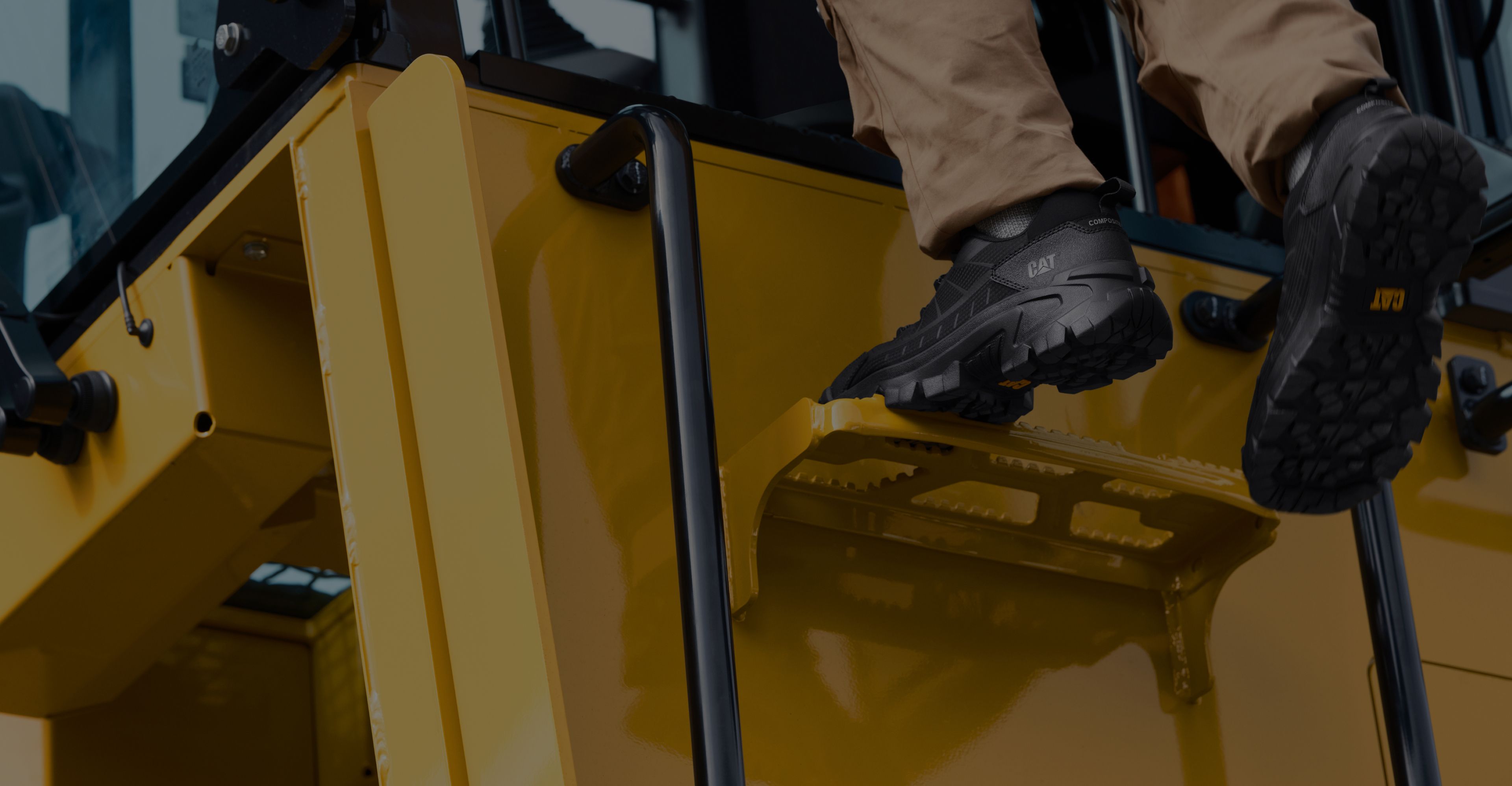 Climbing into the cab of a machine.