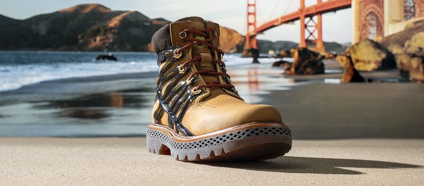 Brown boot on a beach with the Golden Gate Bridge in the background.
