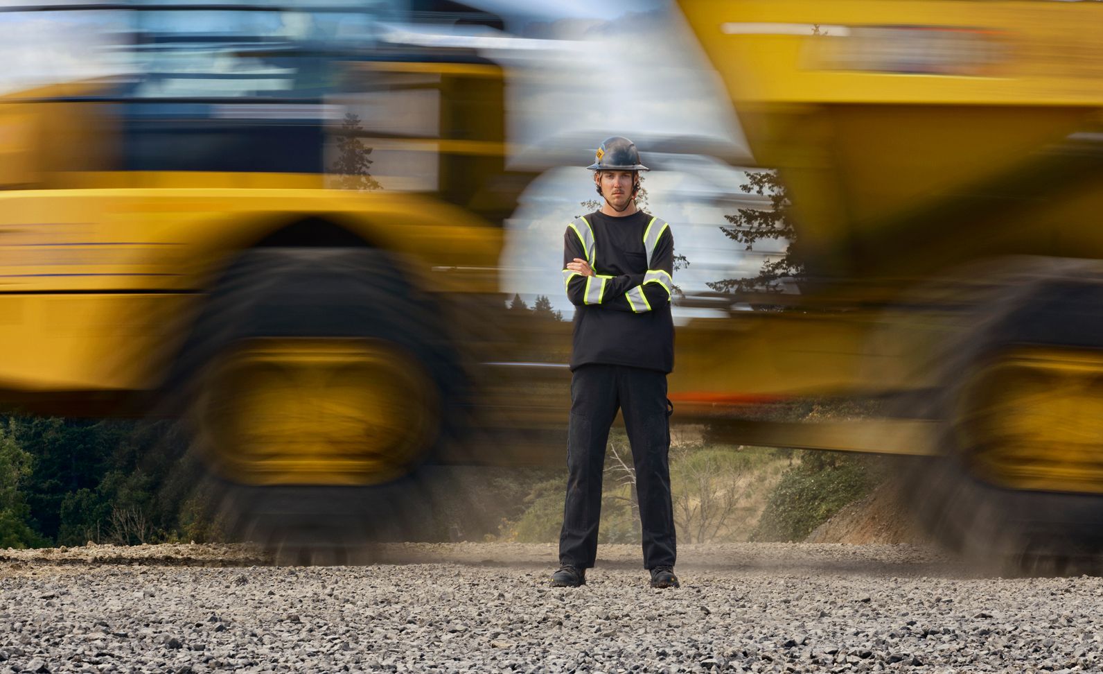 Standing in front of a fast-moving truck with motion blur.