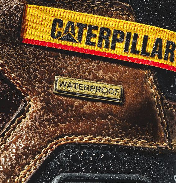 Close-up of water beading on the side of a shoe.