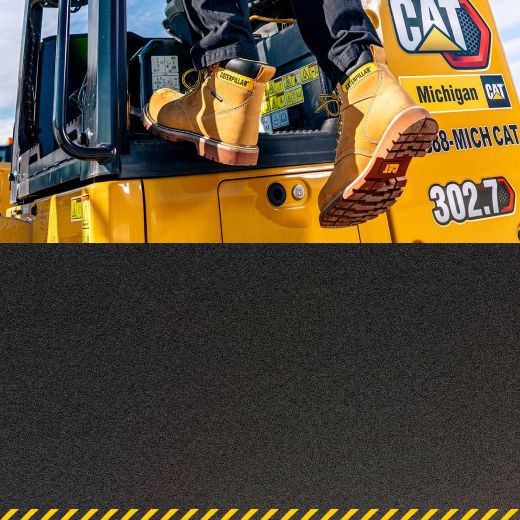 Boots getting into the cab of heavy machinery.